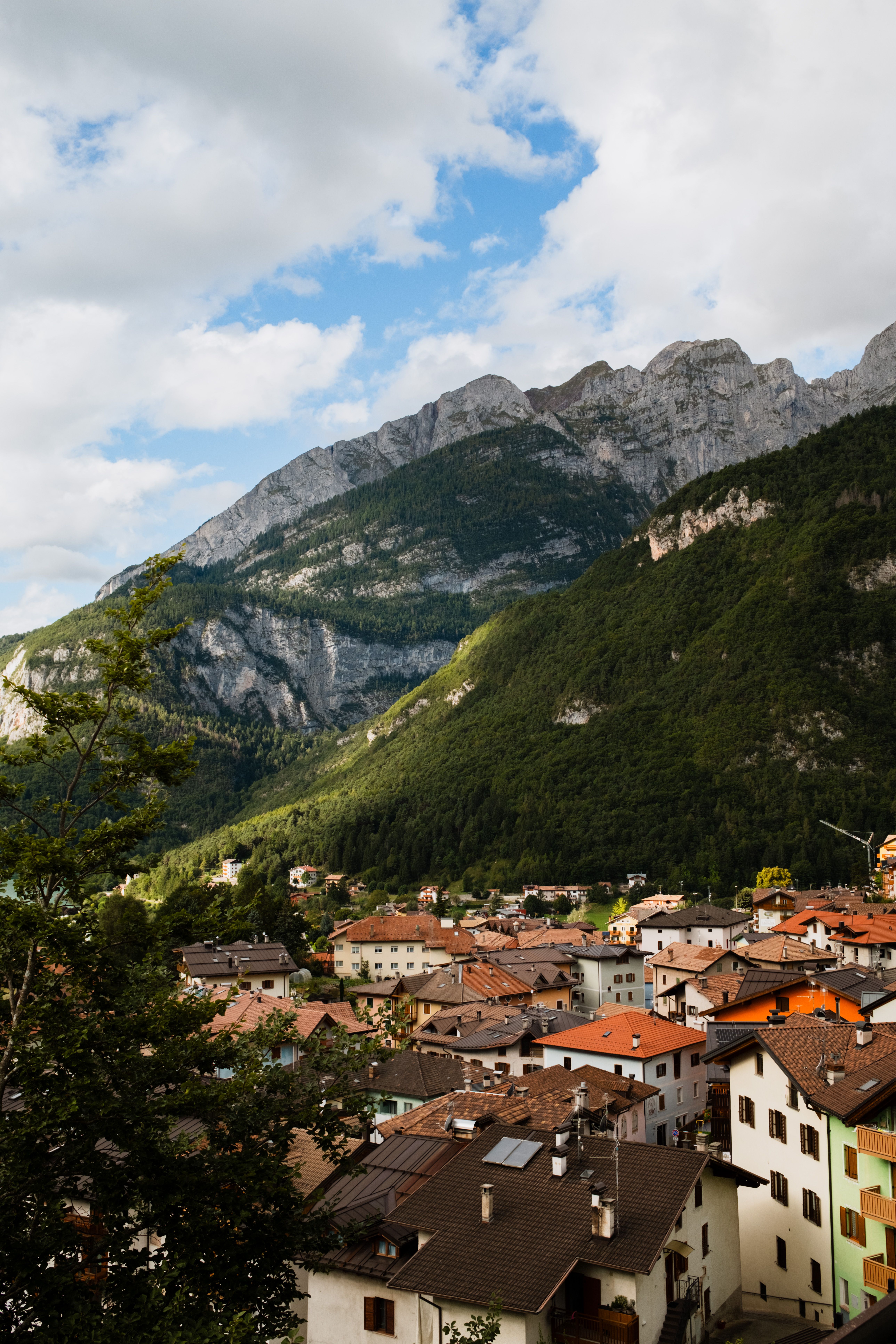 Alpine valley and village beneath the mountains near Sondrio, Valtellina