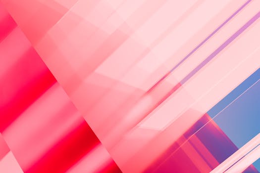 Vibrant abstract geometric pattern with pink and blue gradients creating a modern artistic background.