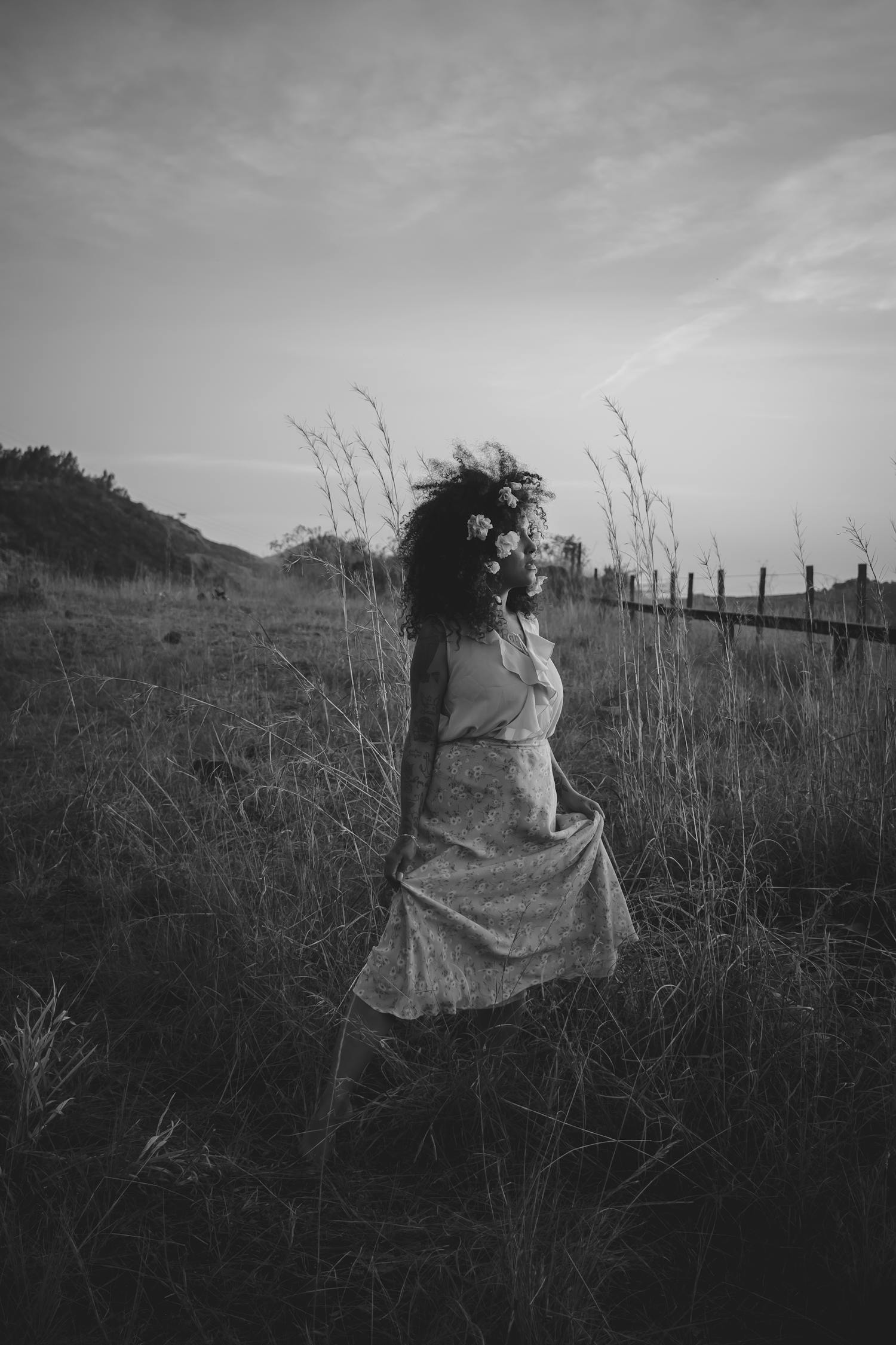 Monochrome Photo Of Woman Standing On Field