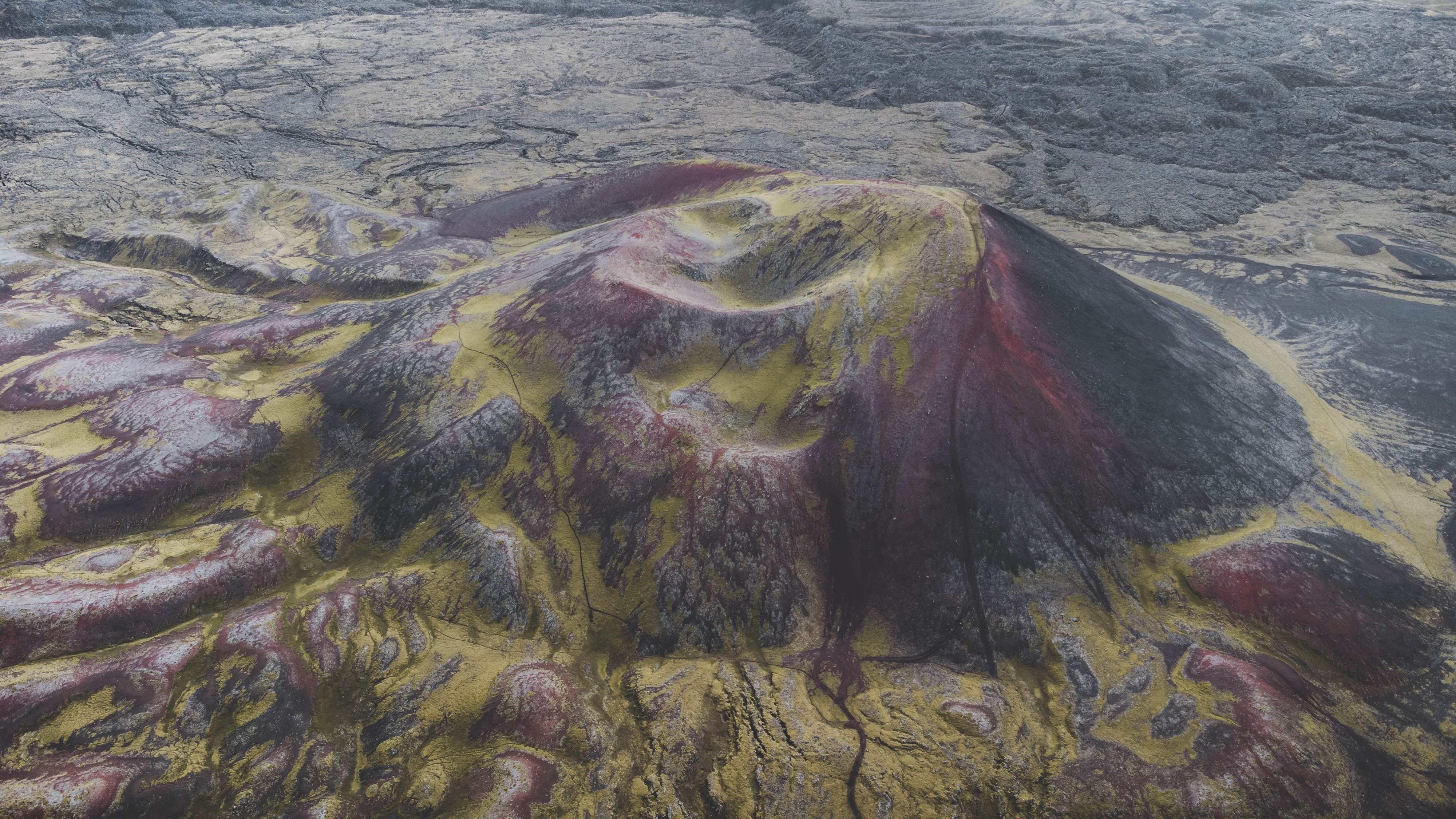 Big Island, Hawaii: Volcanoes National Park Safari - Striking aerial shot showcasing a vibrant volcanic landscape with unique red and yellow hues.