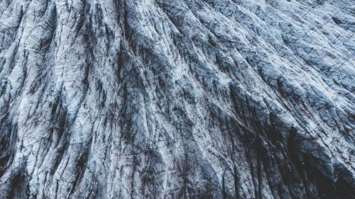 Free A detailed aerial view of icy glacier textures highlighting natural patterns and rugged beauty. Stock Photo