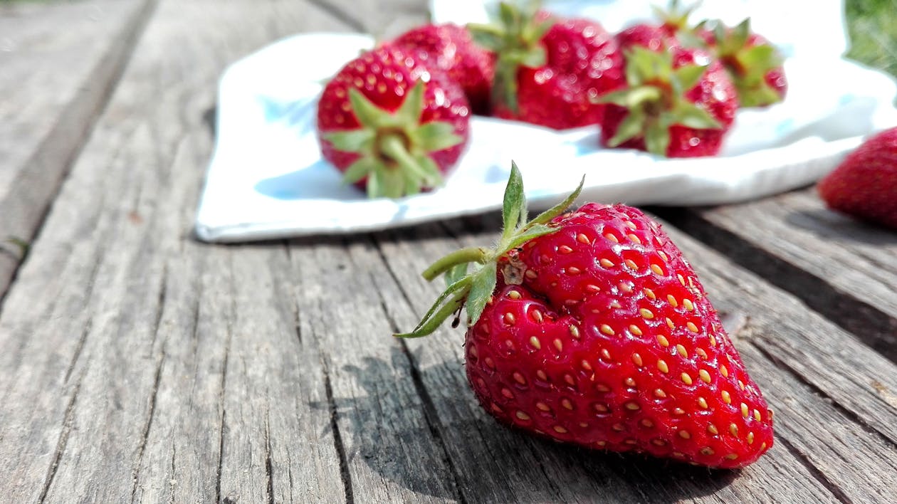 Free Strawberries on Top of Brown Table Stock Photo