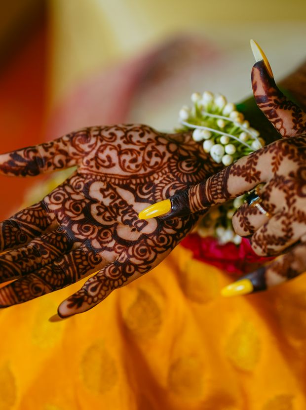 Intricate bridal mehndi covering a woman's hands