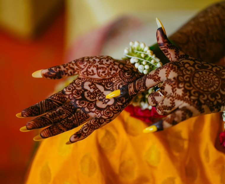 Intricate bridal mehndi covering a woman's hands