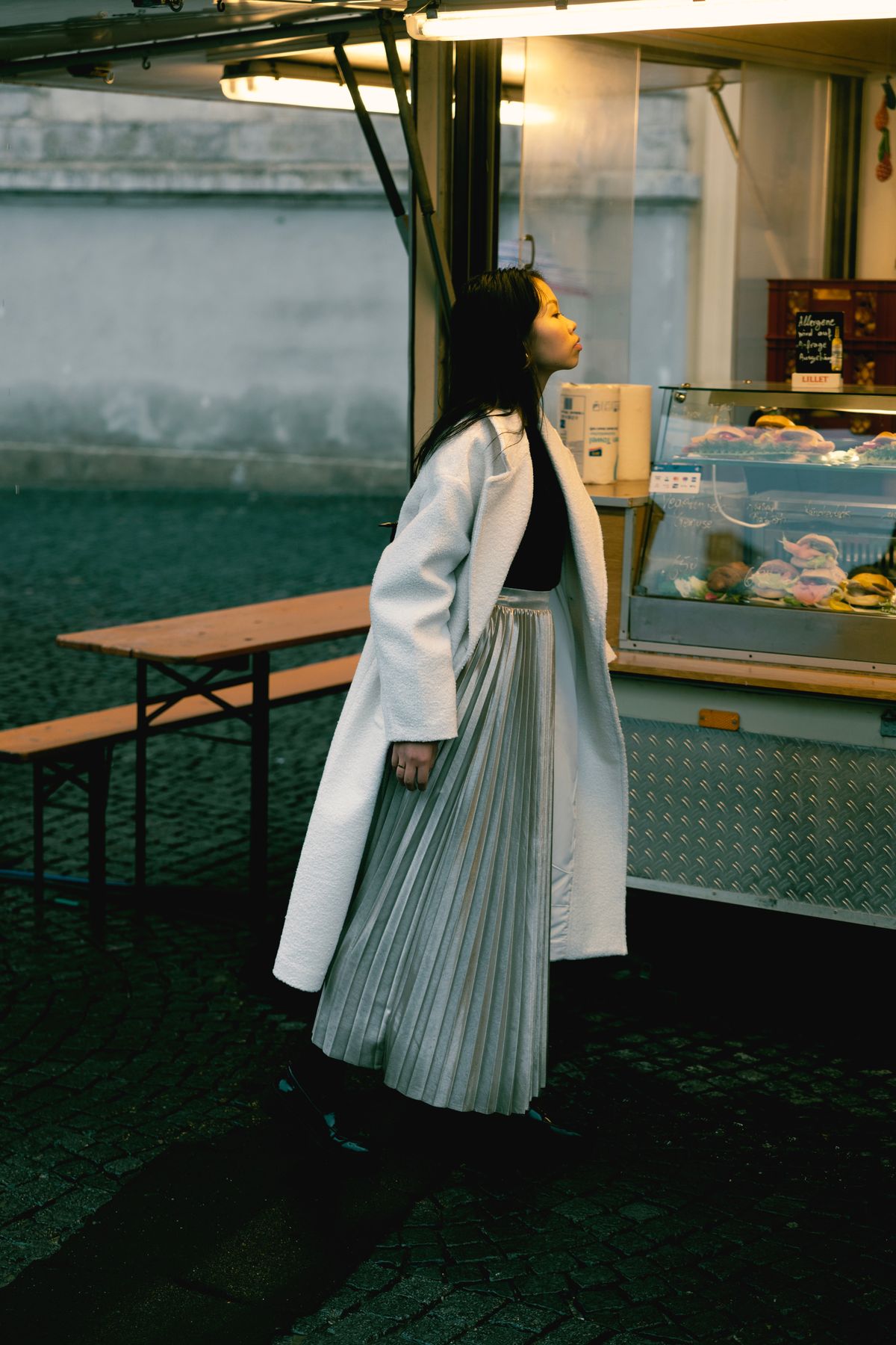 Élodie skirt styled with a winter coat outdoors