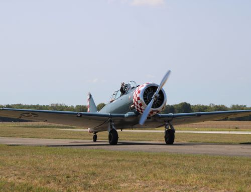 Free T-6 Texan aircraft preparing for takeoff at Circleville airport, showcasing vintage military aviation. Stock Photo