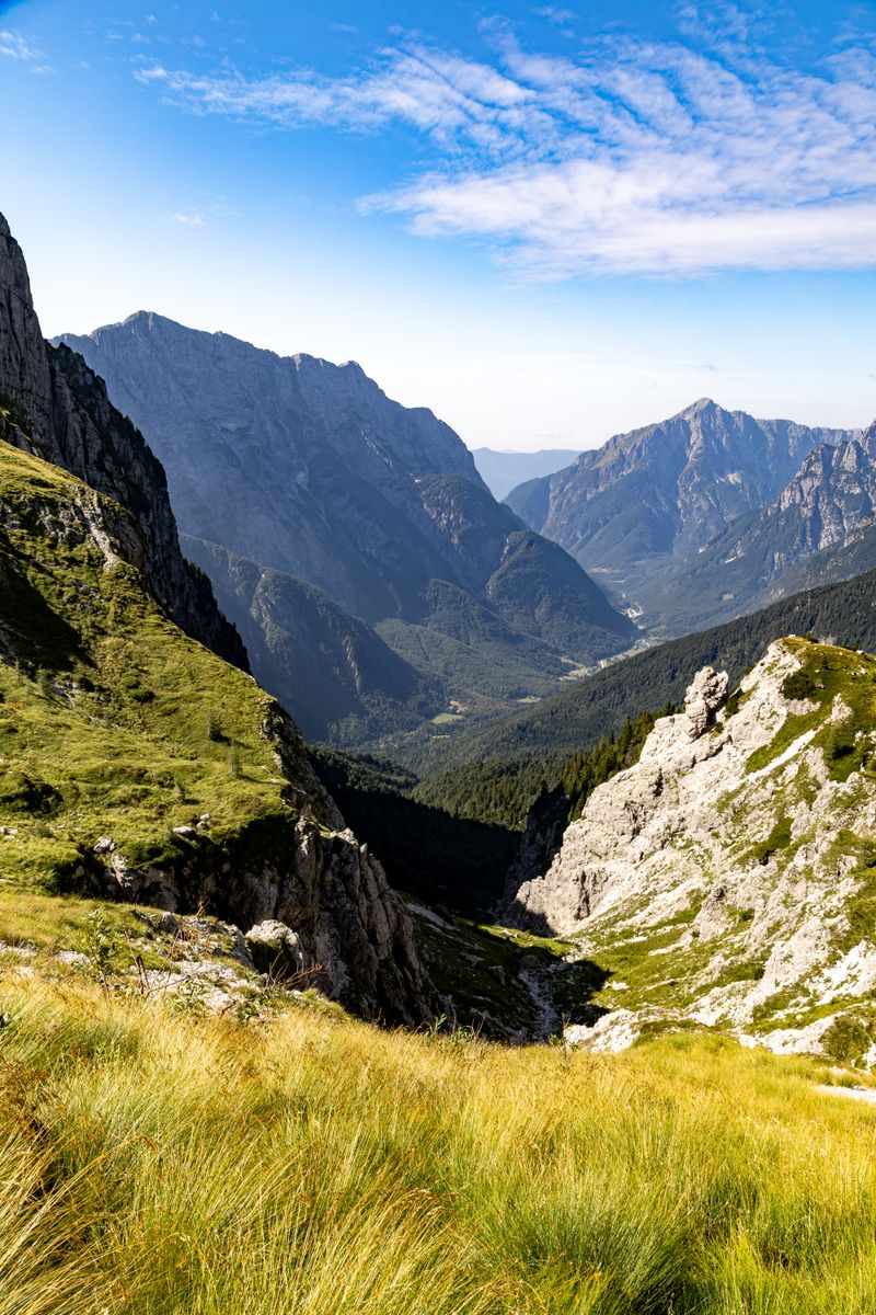 Explore the breathtaking alpine scenery of the Julian Alps with lush meadows and towering peaks.