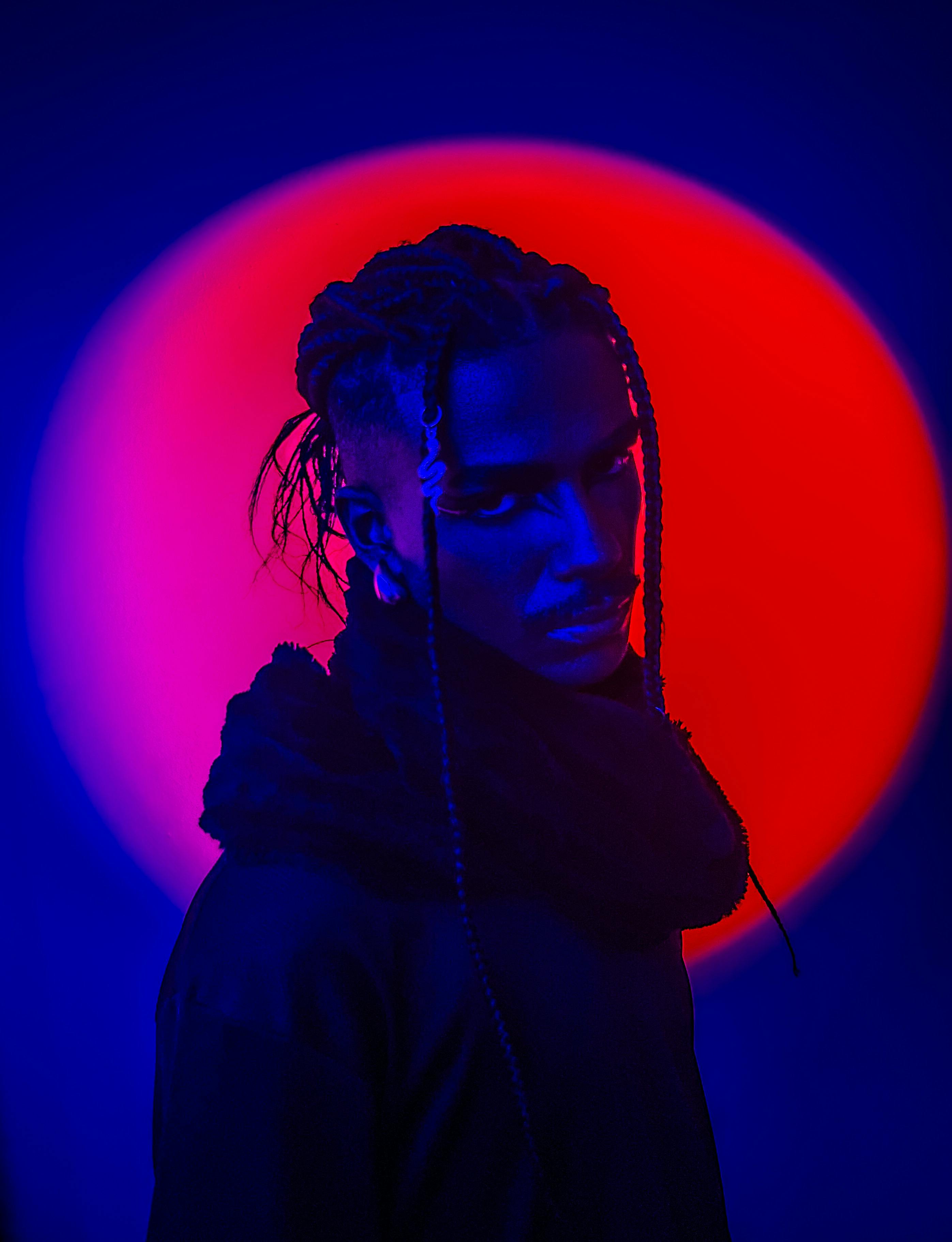 dramatic portrait in vibrant red and blue lighting