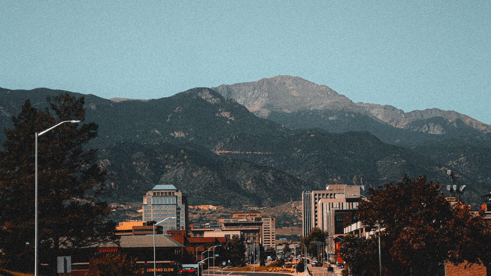 Downtown Colorado Springs with the mountains rising behind the city