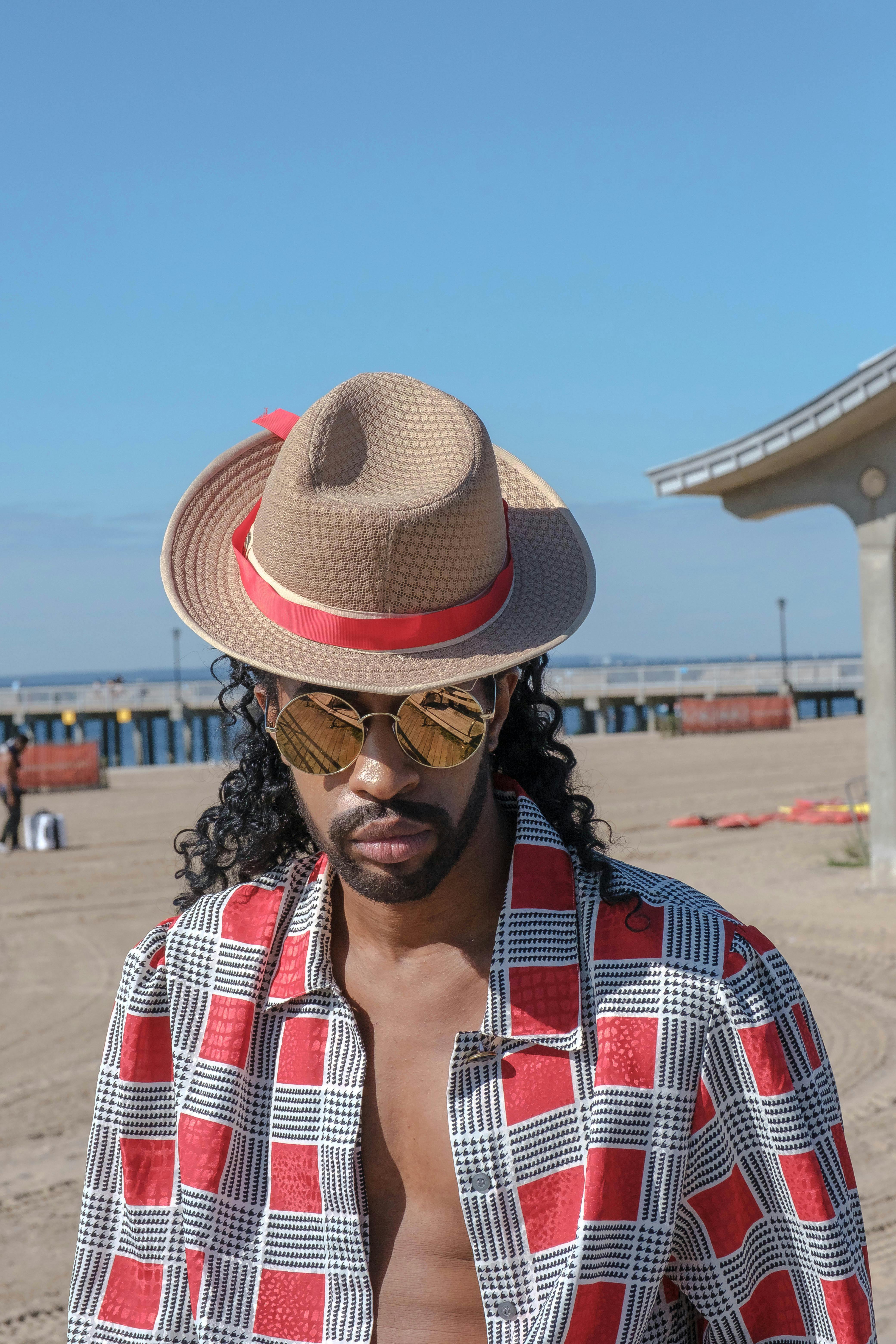 photo of man wearing sun hat