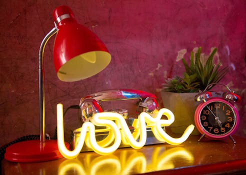 Bright neon love sign with retro decor, perfect for romantic vibes.