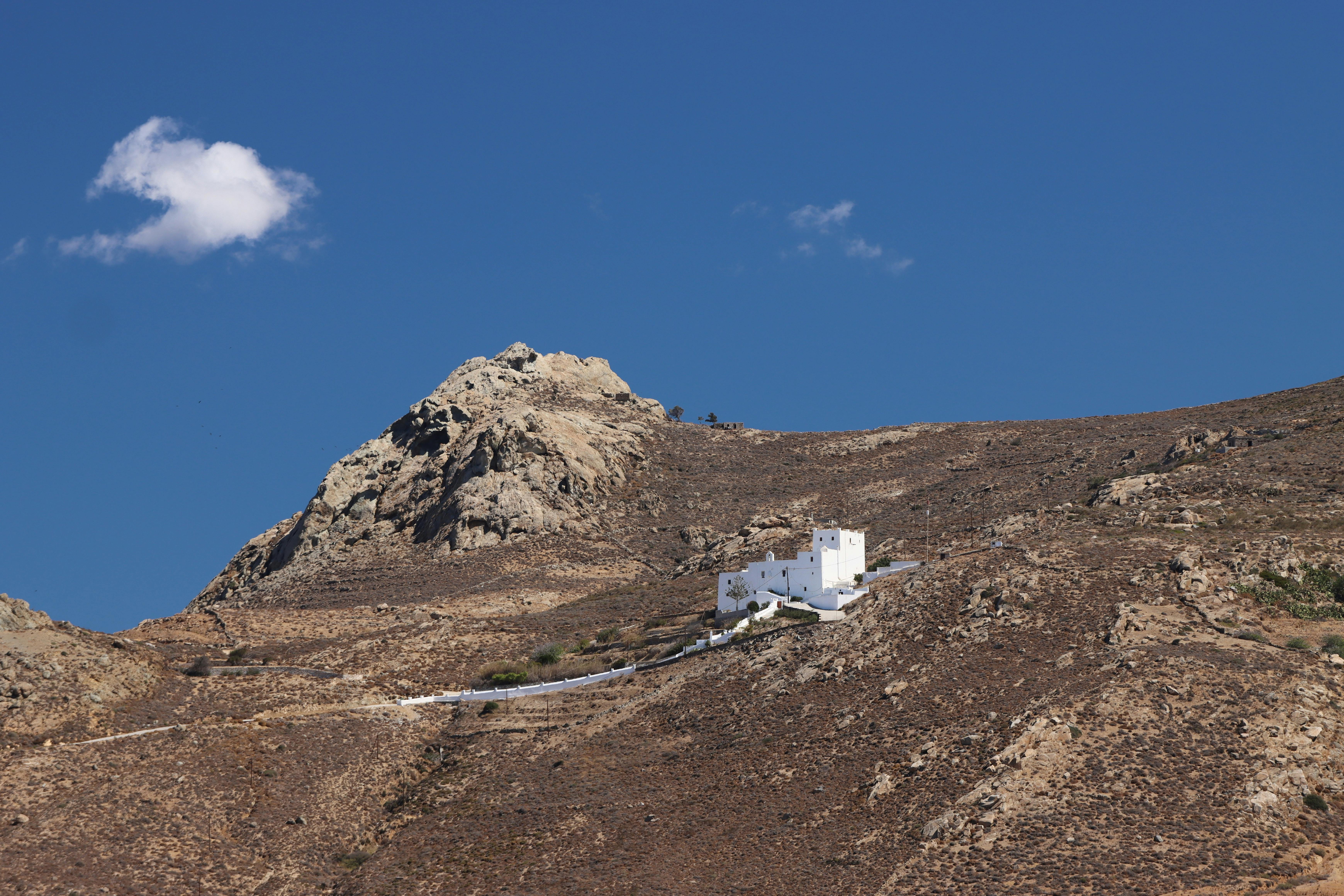 white house on mountainous landscape in naxos