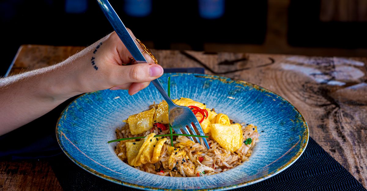 Eating Frid Rice Person Enjoying Fried Rice with Tofu Dish · Free Stock Photo