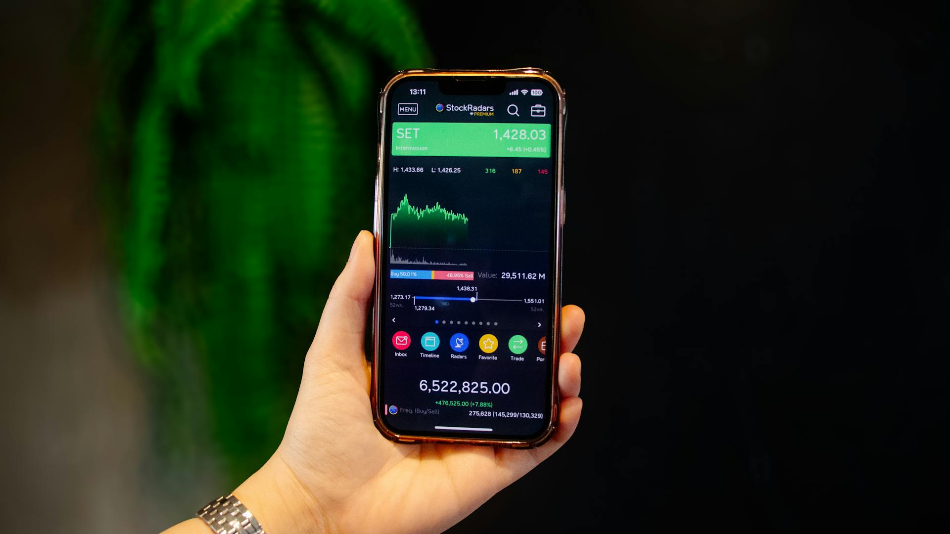 Smartphone Displaying Stock Trading App in Hand