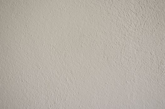 A close-up view of a textured white wall suitable for creative design projects.
