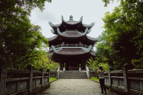 Free Explore the intricate traditional architecture of Bai Dinh Pagoda surrounded by lush greenery. Stock Photo