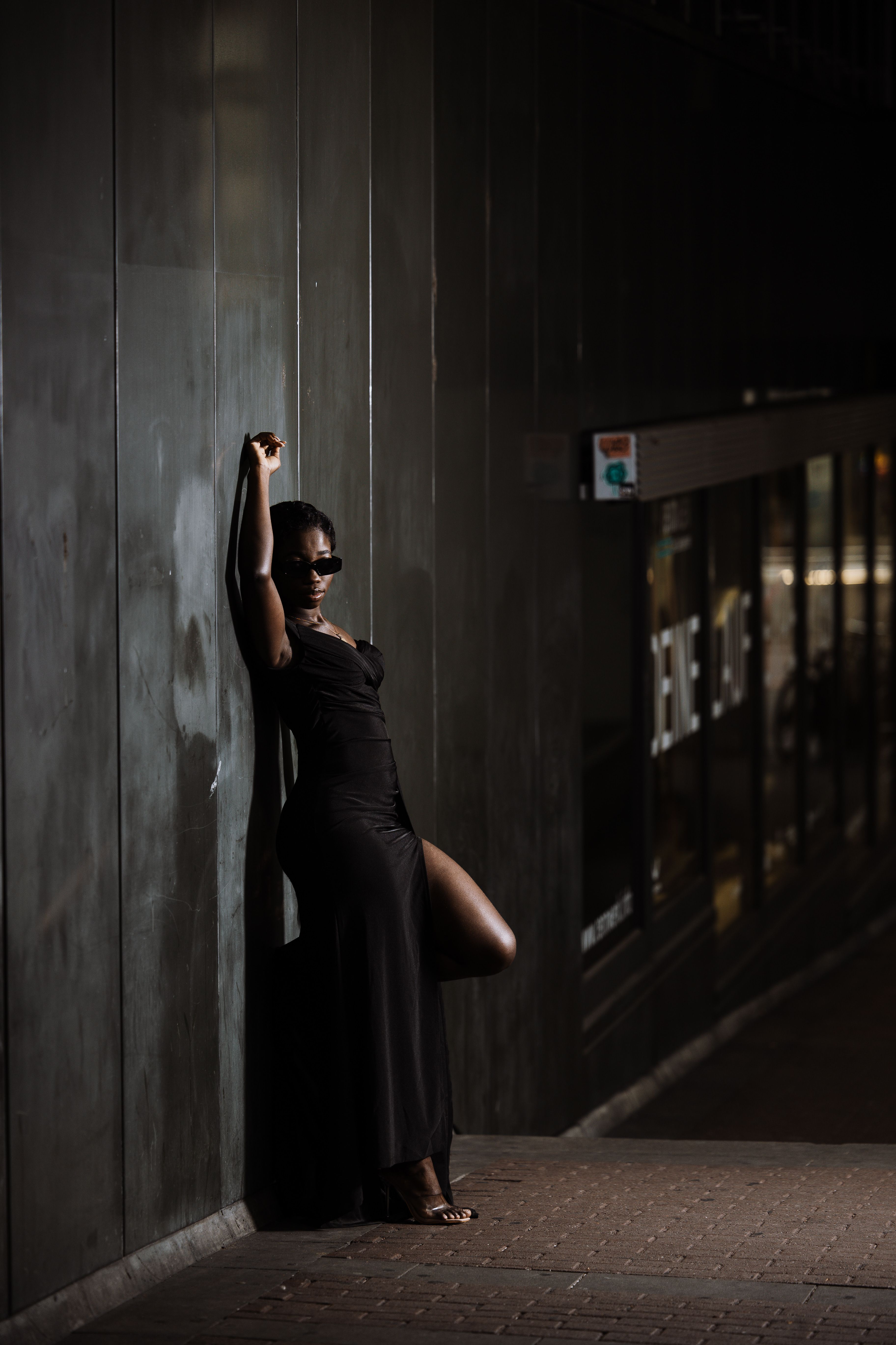 Stylish Woman Posing in Evening Urban Setting · Free Stock Photo