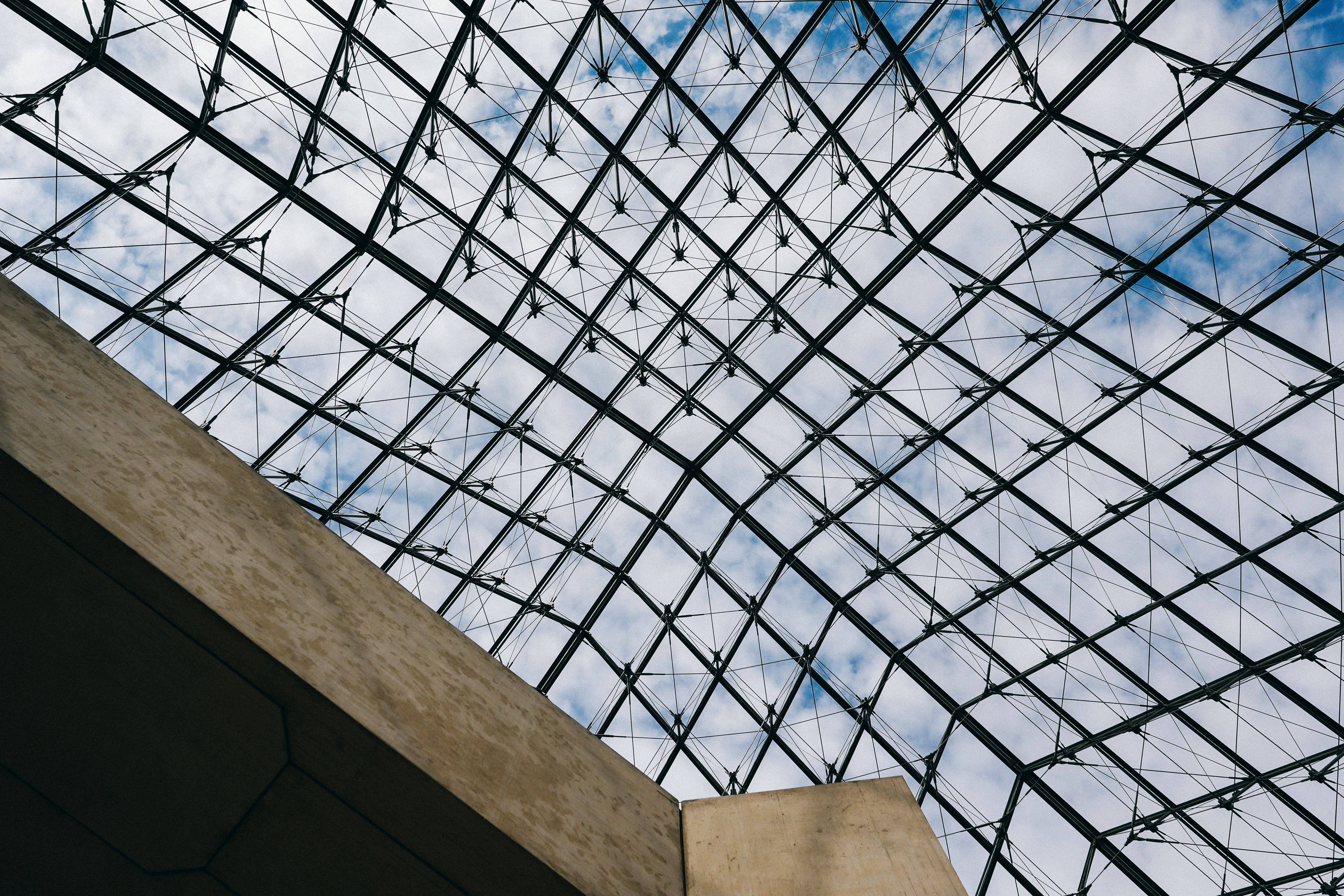 View of the geometric glass structure at a famous museum in Paris.