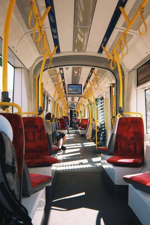 Interior of Warsaw tram with yellow handrails · Free Stock Photo