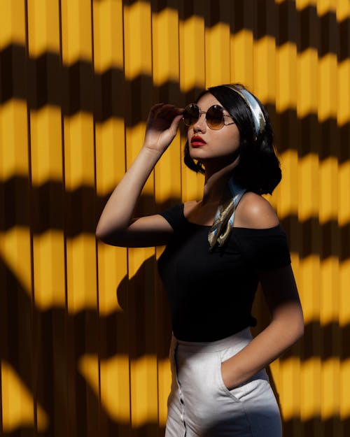 Free Woman Holding Sunglasses Stock Photo