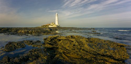 Free Captivating view of St. Mary's Lighthouse on coastal rocks in Northumberland. Stock Photo