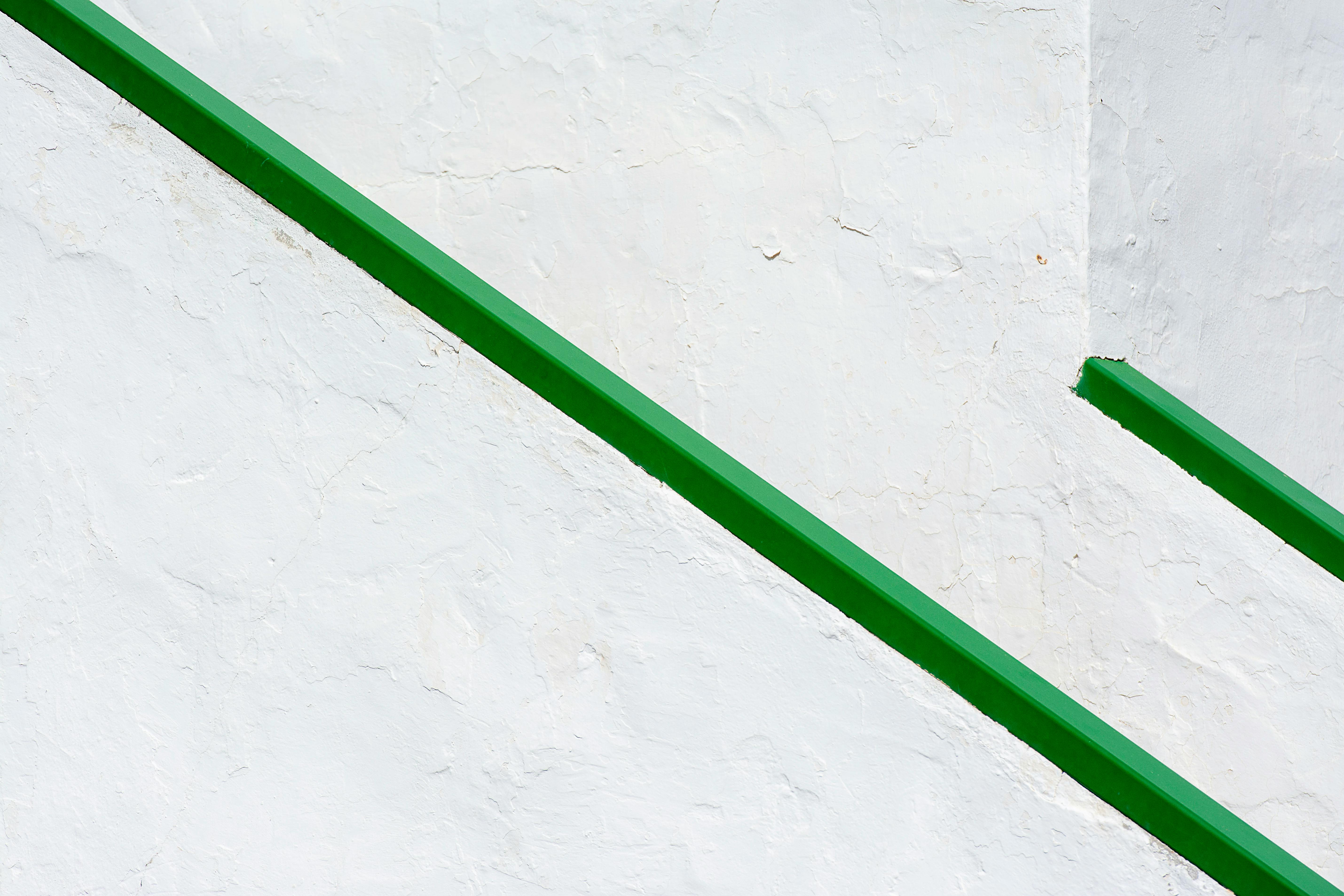 Minimalist Green Railings on White Wall · Free Stock Photo