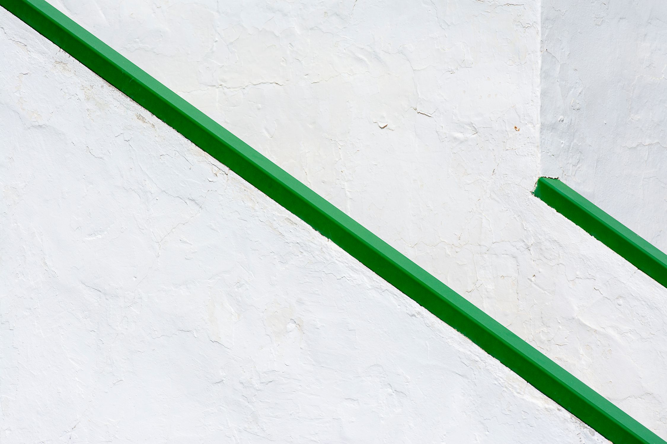 Green Railing Color Minimalist Green Railings on White Wall · Free Stock Photo