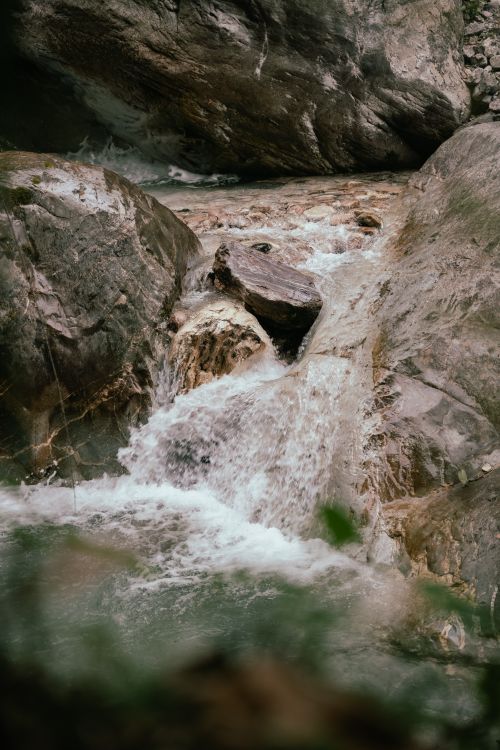 Free A calming waterfall cascading through rugged rocks, showcasing nature's purity and tranquility. Stock Photo