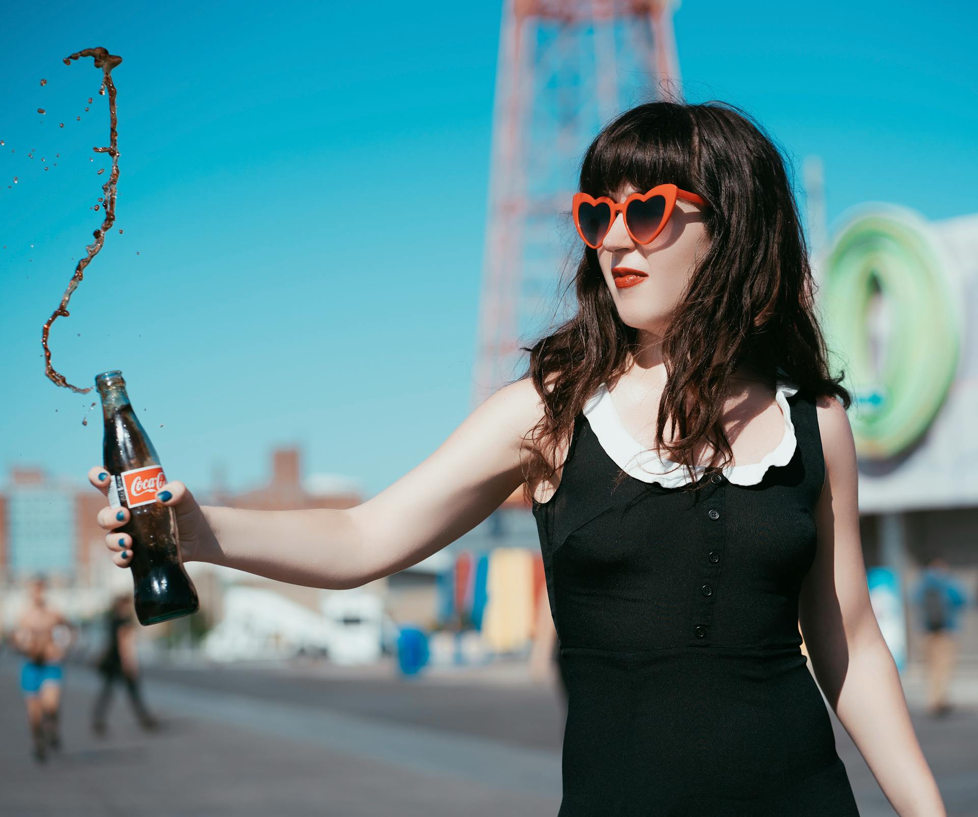 Woman Holding Coca Cola Bottle