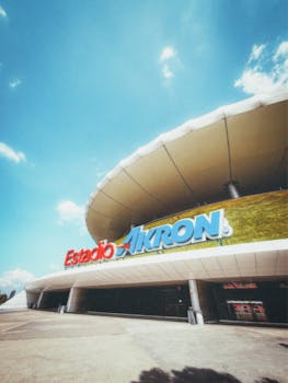 Wide-angle view of Estadio Akron in Guadalajara on a sunny day.
