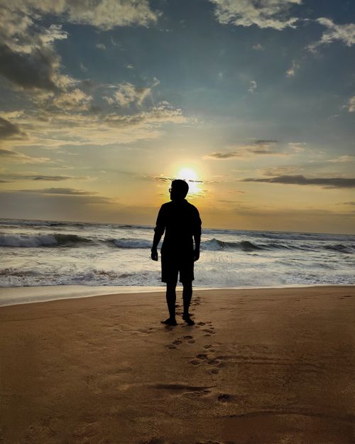 Free Sunset Stroll at Calangute Beach Stock Photo