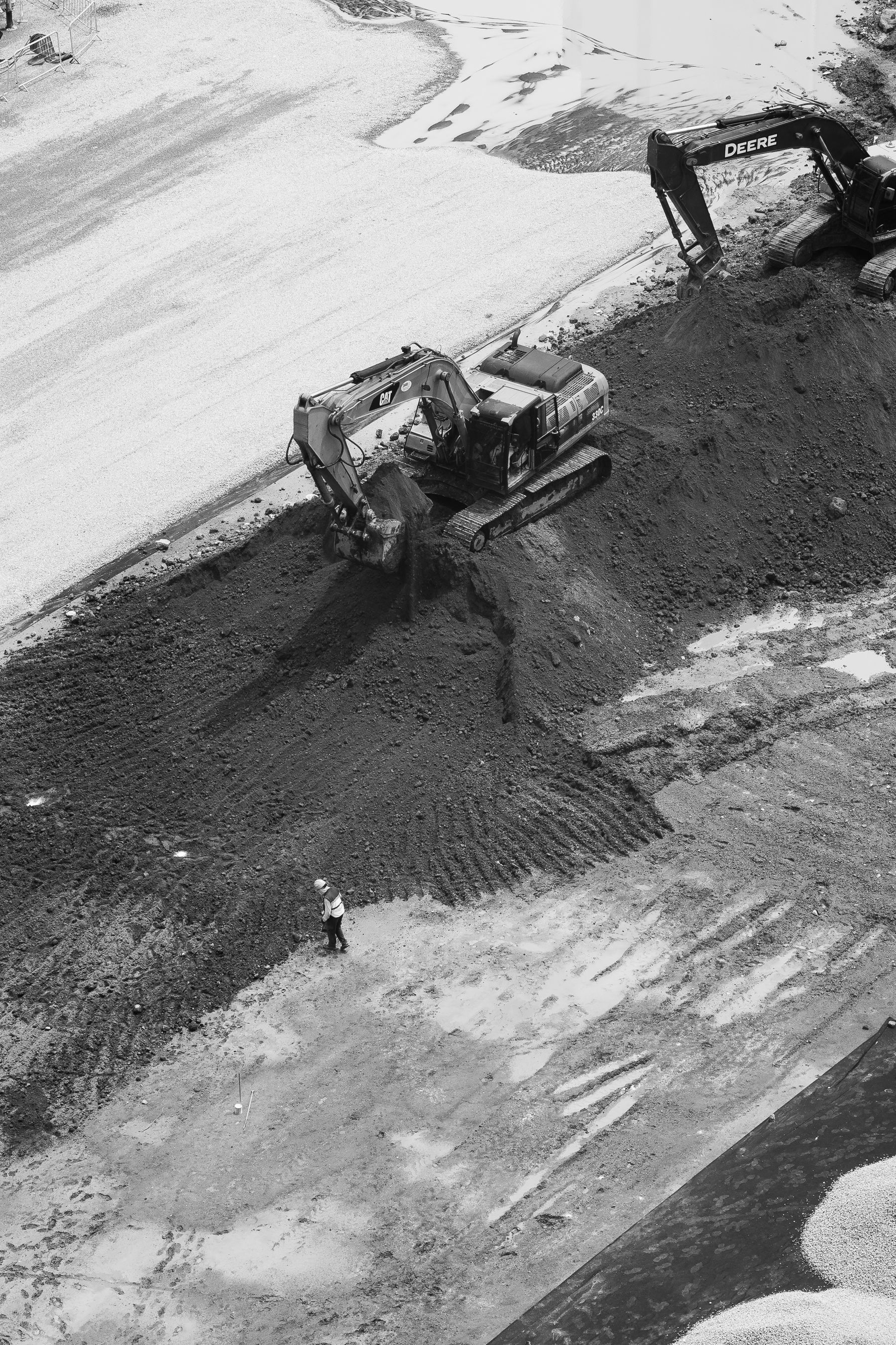 Aerial view of construction with excavators and worker in Ciudad de México.