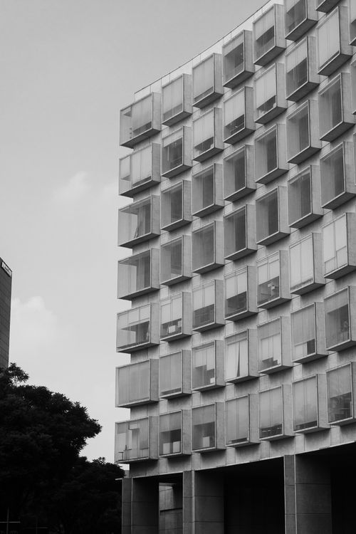 Free Black and white photo of a modern building facade in Mexico City. Stock Photo