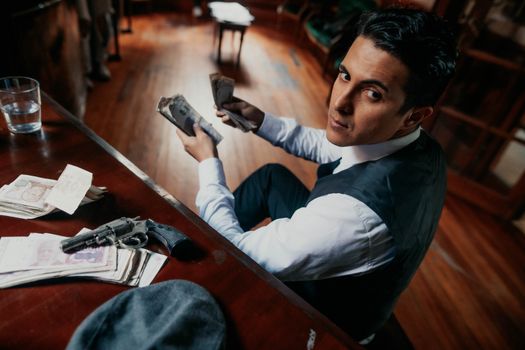Man counting money at a table with vintage items, creating a suspenseful atmosphere.