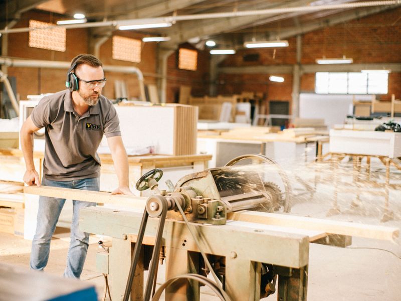 Carpenter building a custom piece in the shop