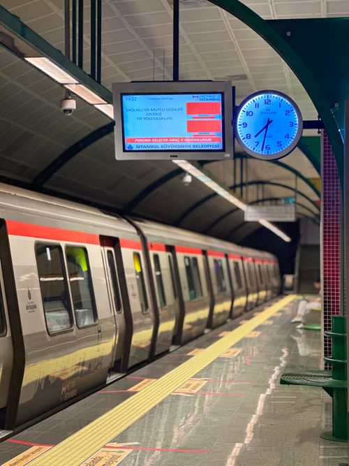 Free Empty metro platform in Istanbul showcasing modern train and station clock. Stock Photo