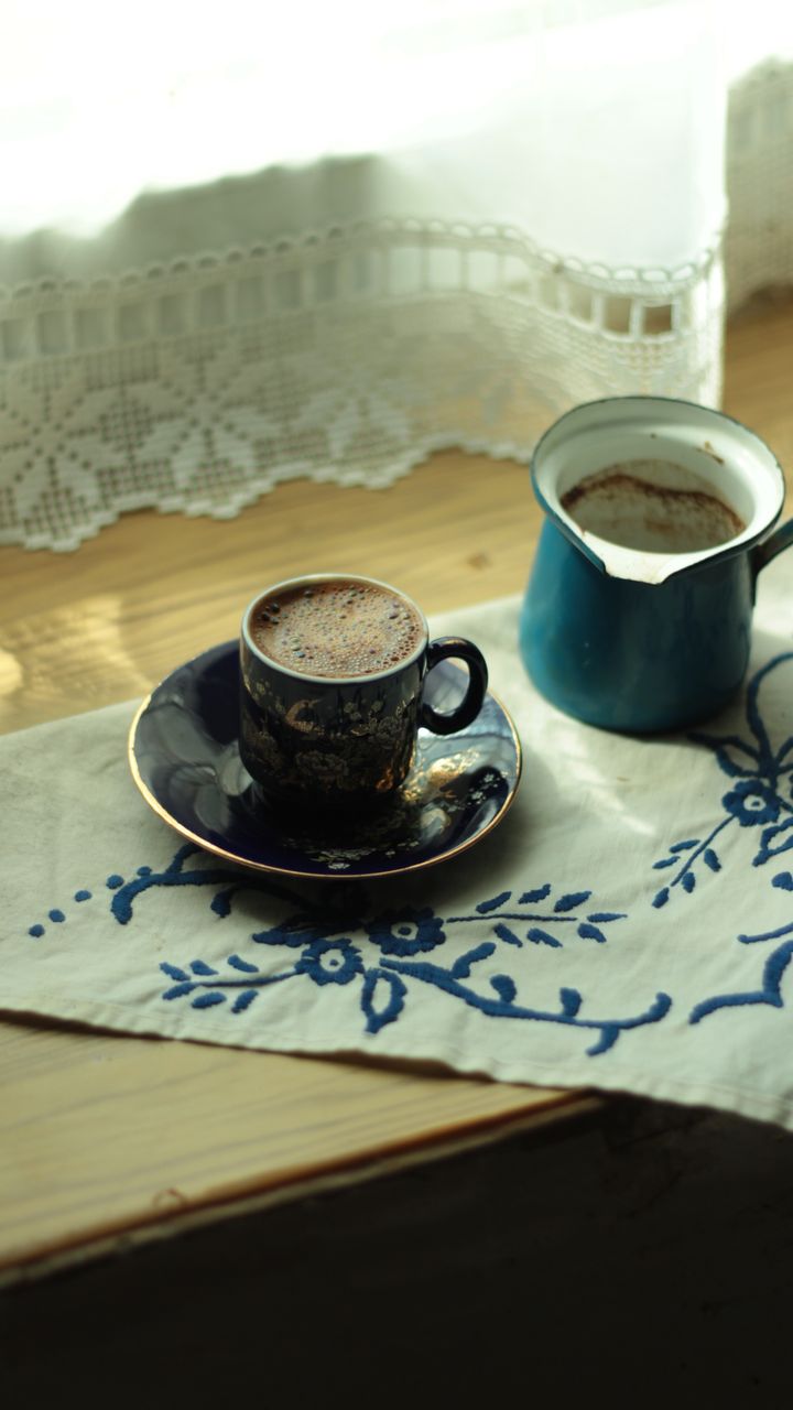 Neutral linen curtain panel hung behind a cozy coffee and tea bar