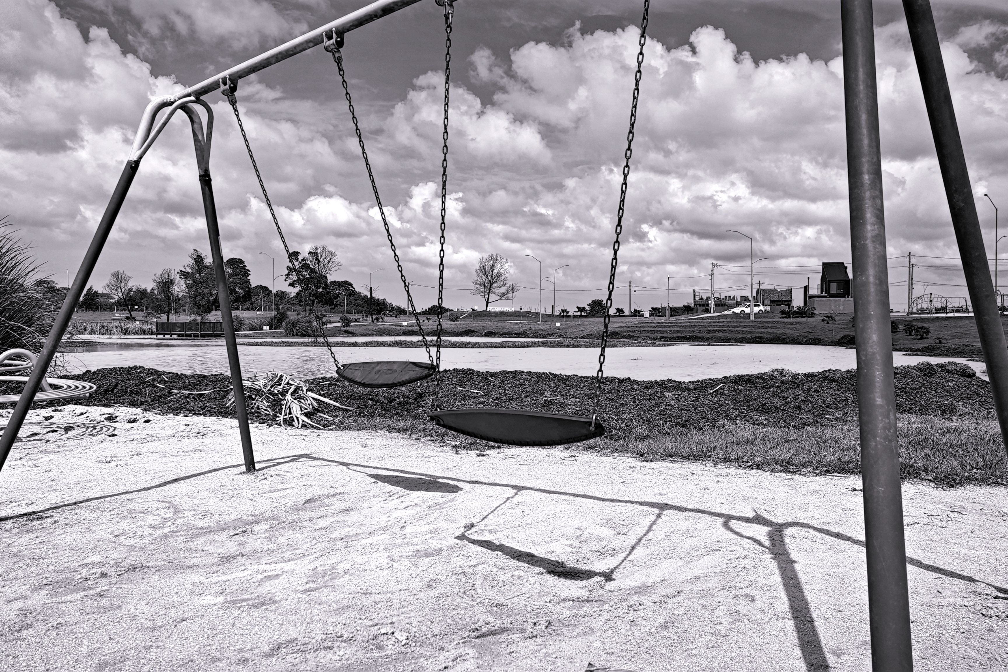 Abandoned Playground Swing in Black and White · Free Stock Photo