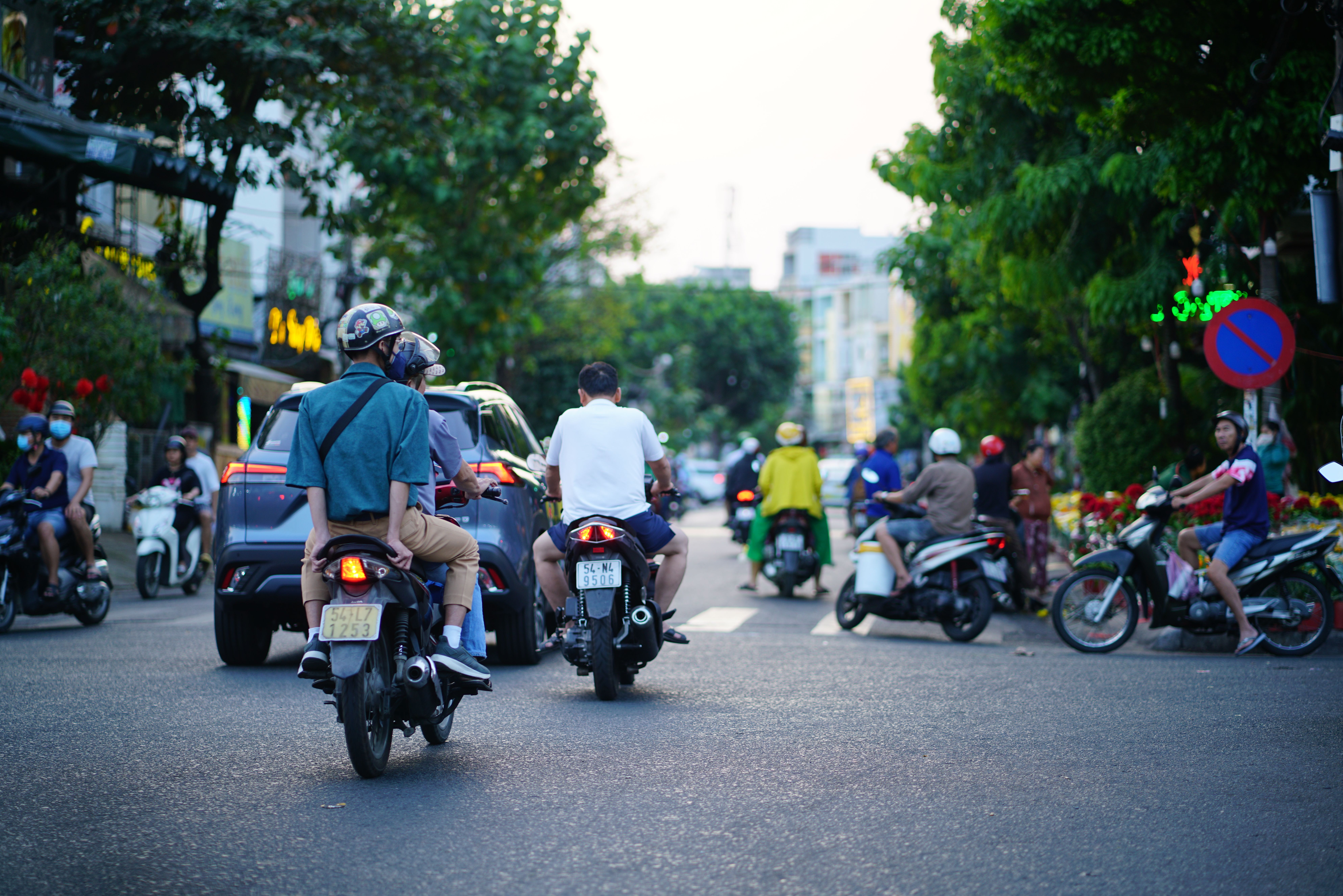 Motorbike traffic at an intersection in Ho Chi Minh City, Vietnam, showcasing urban life.