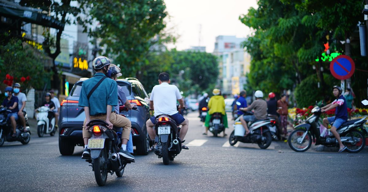 Motorbikes crossing an intersection in Ho Chi Minh City