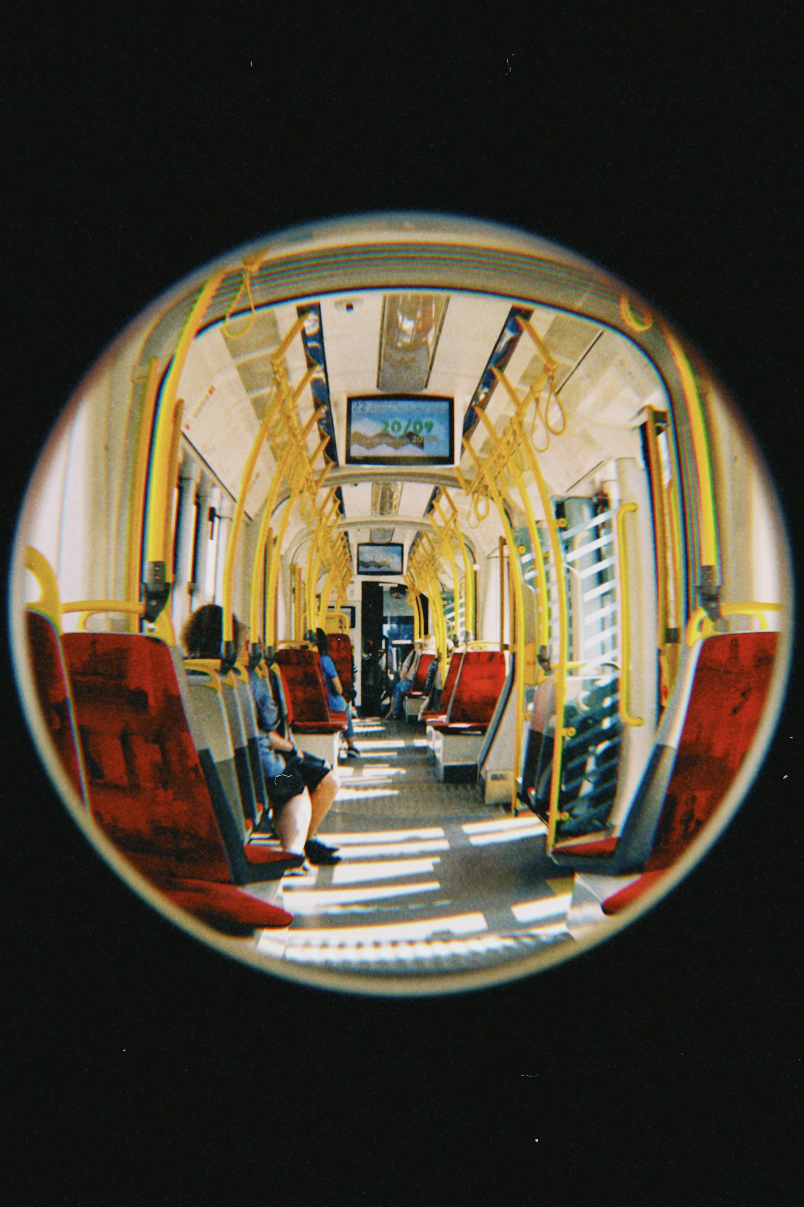 Unique fish-eye view inside a Warsaw tram showcasing urban travel and lifestyle.