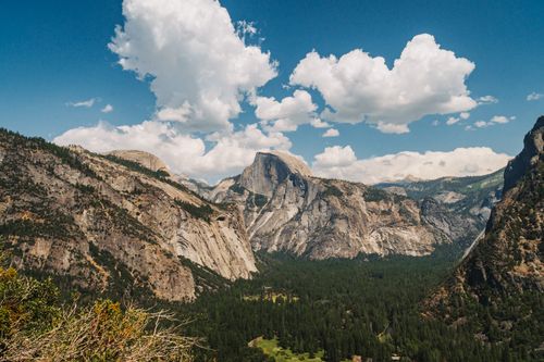 Free Breathtaking view of Half Dome and lush valley in Yosemite National Park under a clear sky. Stock Photo