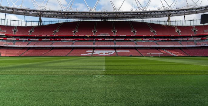 Wide view of an empty Emirates Stadium, home of Arsenal FC, in North London, England.
