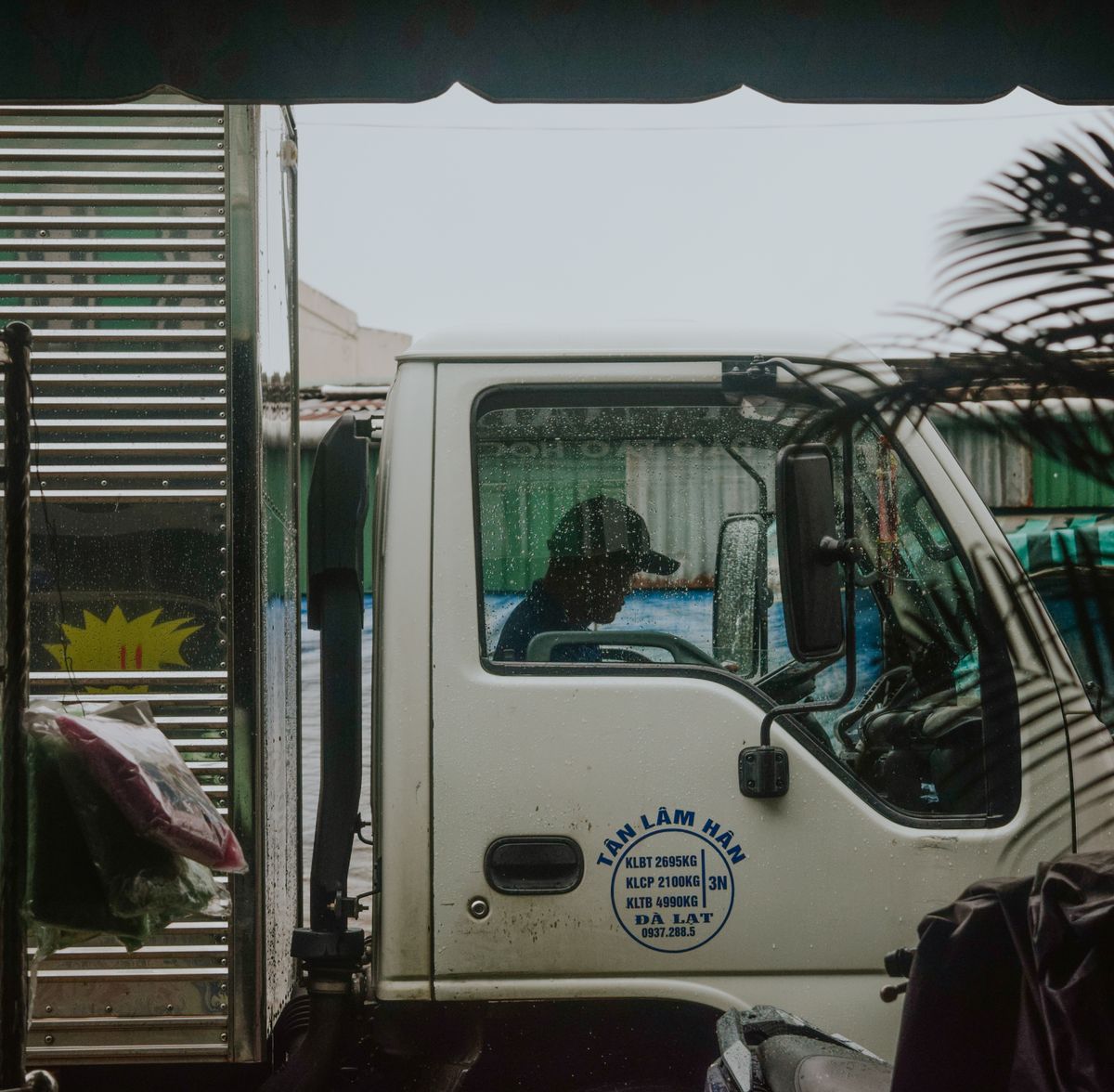 Truck driver working from the cab at night