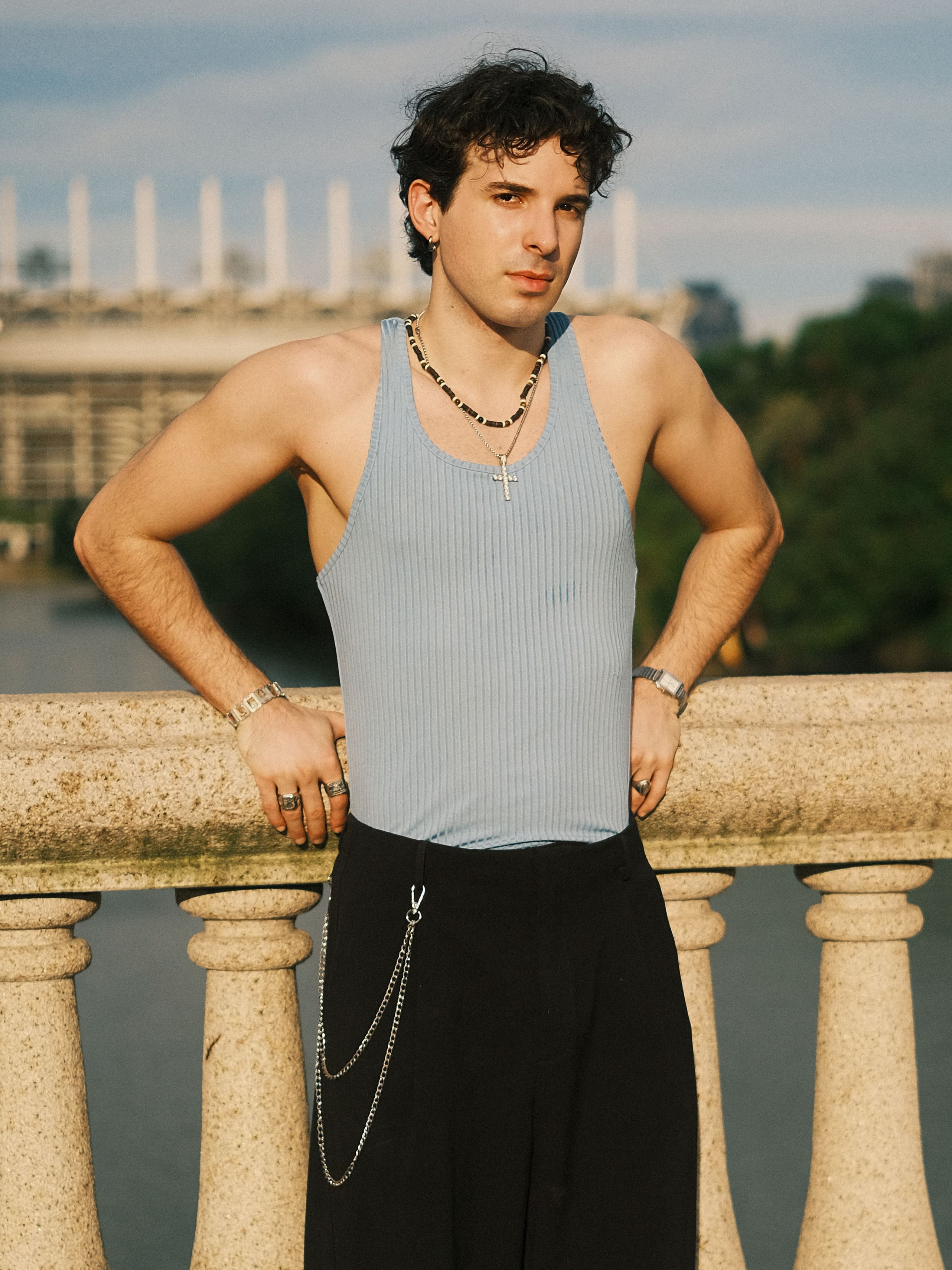 Young Man Posing on Urban Bridge in Daylight · Free Stock Photo