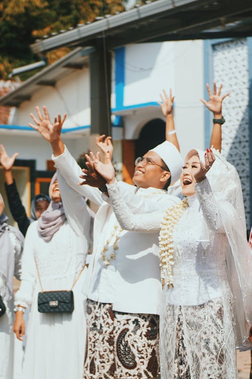 Photo Of People Raising Their Hands