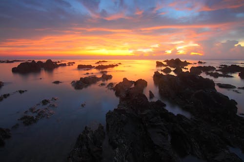 Free Panoramic Photography of Body of Water during Golden Hour Stock Photo