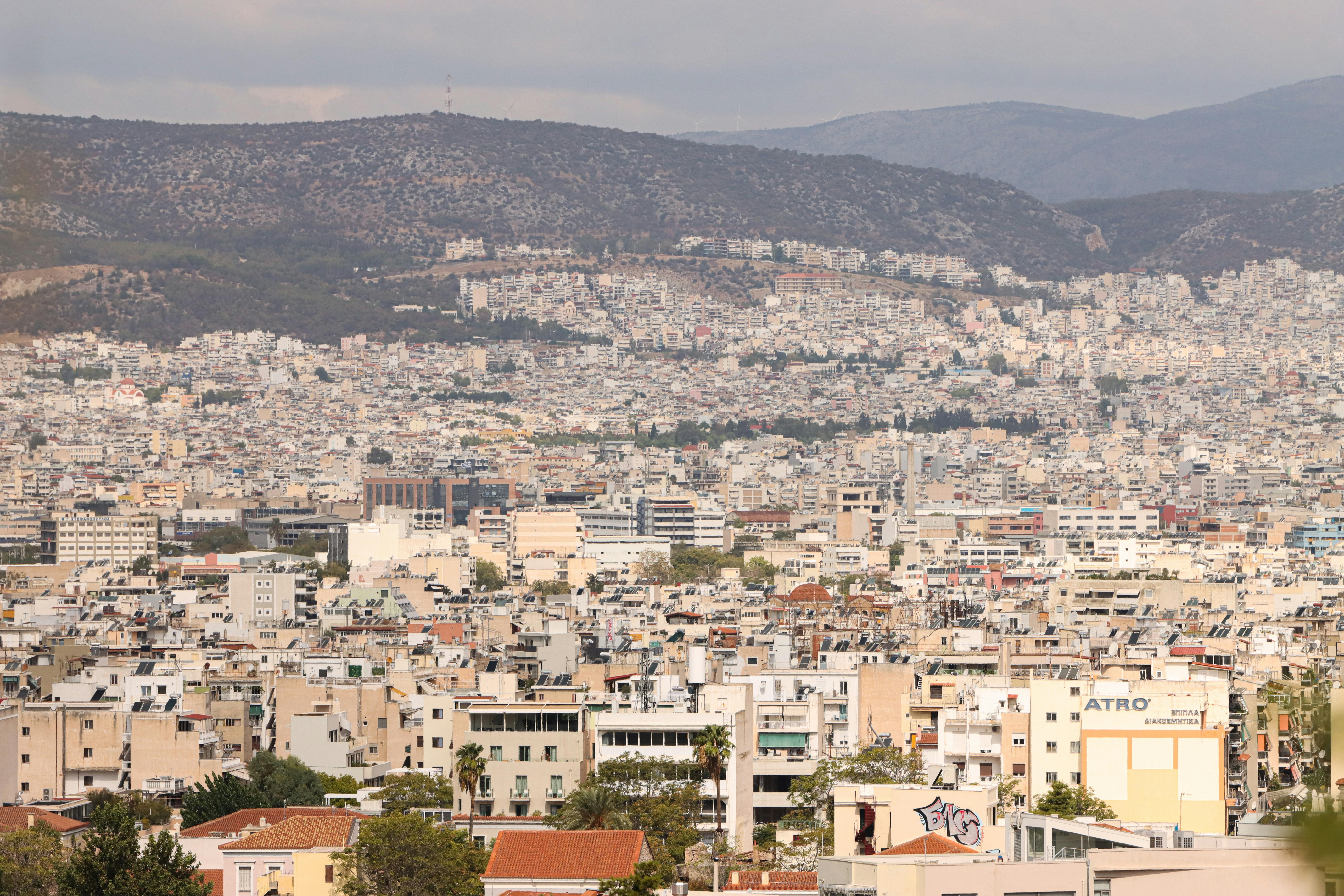 aerial view of athens cityscape with mountains