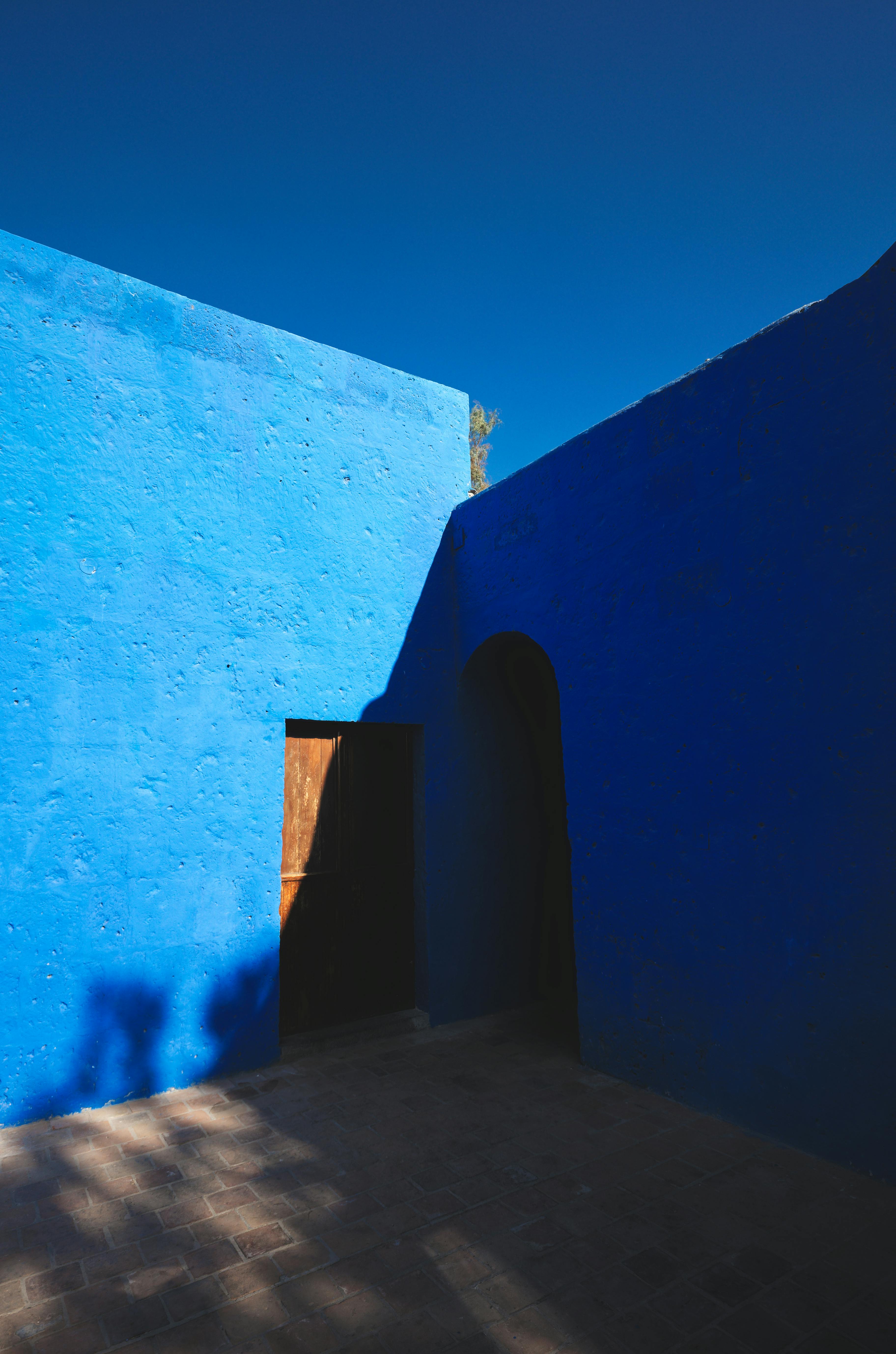 Bright blue colonial architecture in Arequipa, Peru, showcasing vibrant outdoor walls and traditional design.