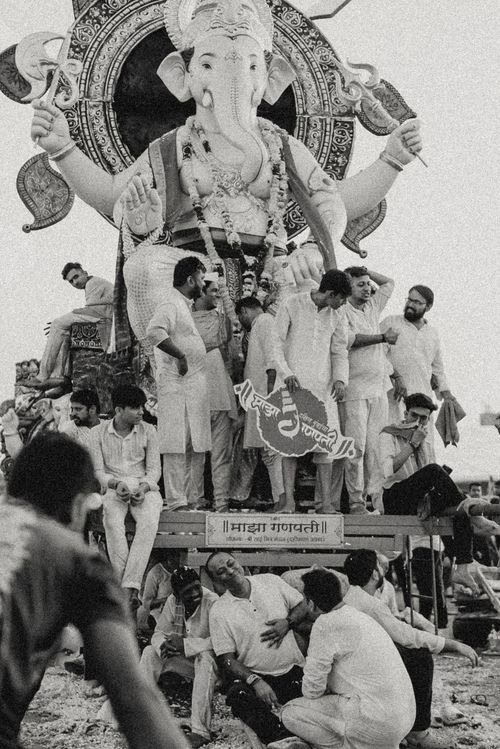 Free Devotees gather around a Ganpati idol during immersion in Mumbai, India. Stock Photo